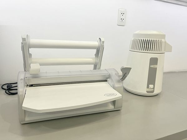 Máy chưng nước cất Dist và máy đóng gói Seal 2